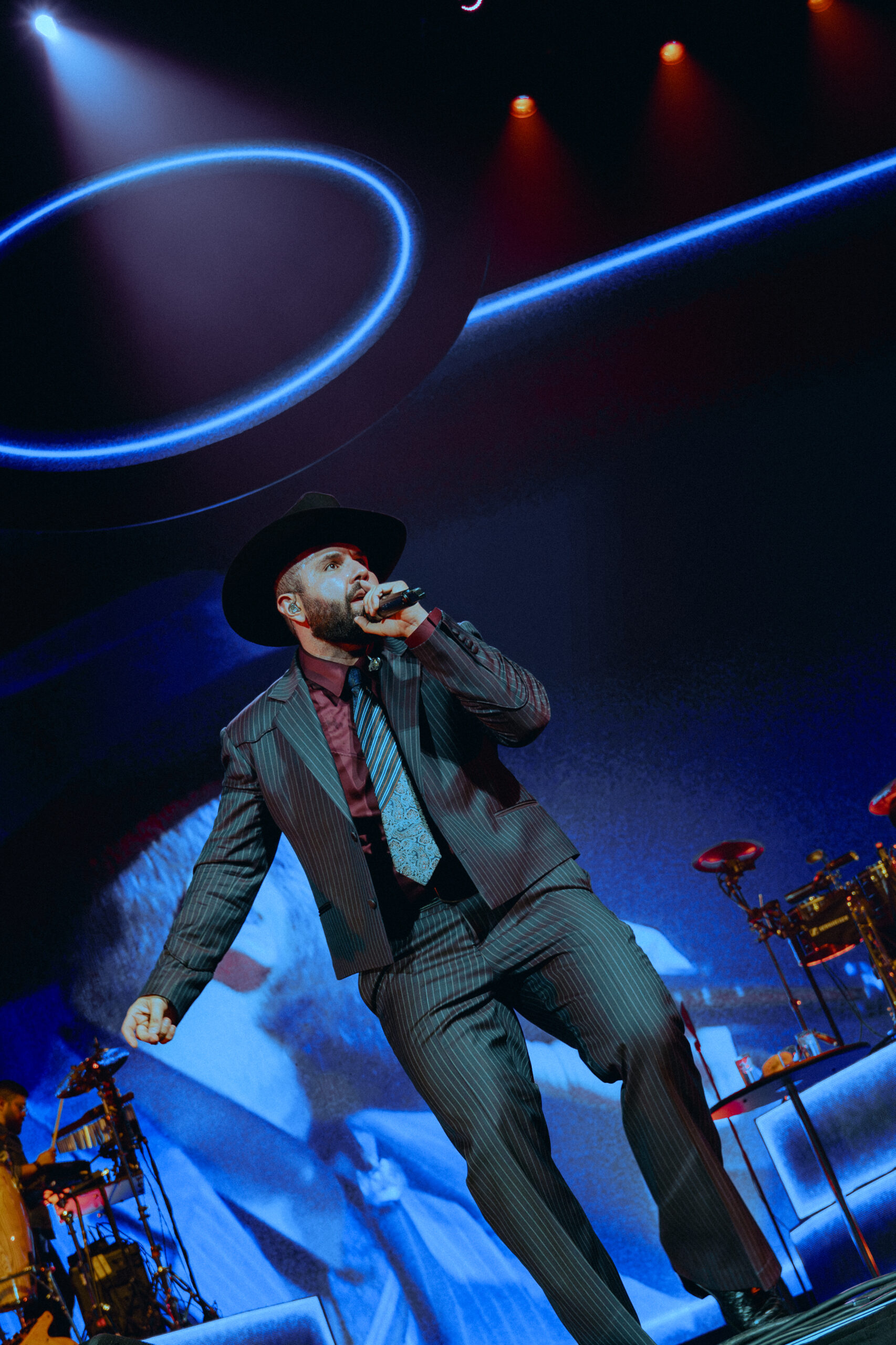 Carín León performing with his band during the De Sonora, Para el Mundo Tour in Houston